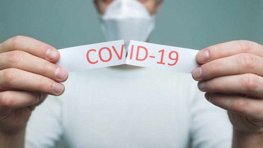 Image of a man wearing a mask representing social distancing during the COVID-19 pandemic