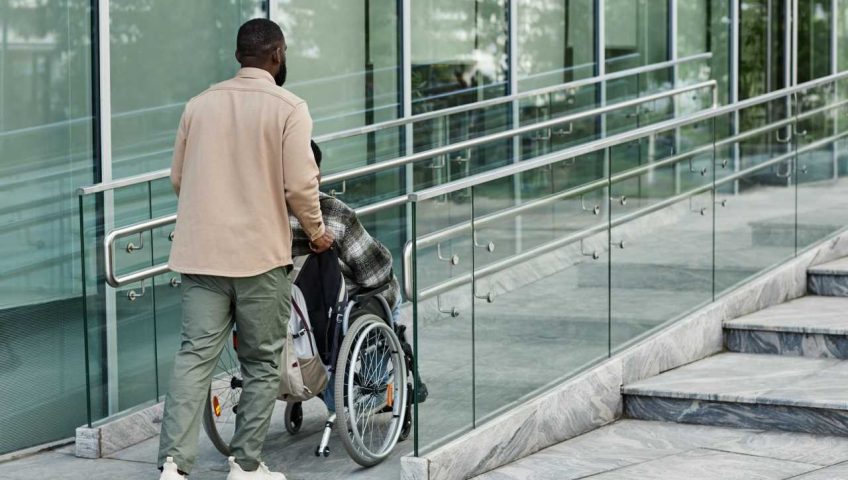 a person using an accessible design for entrance