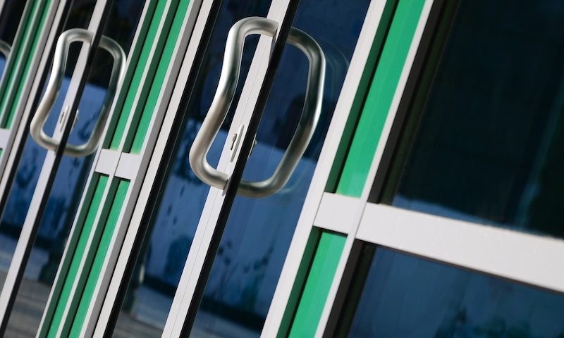 faulty doors. swing doors in a commercial building